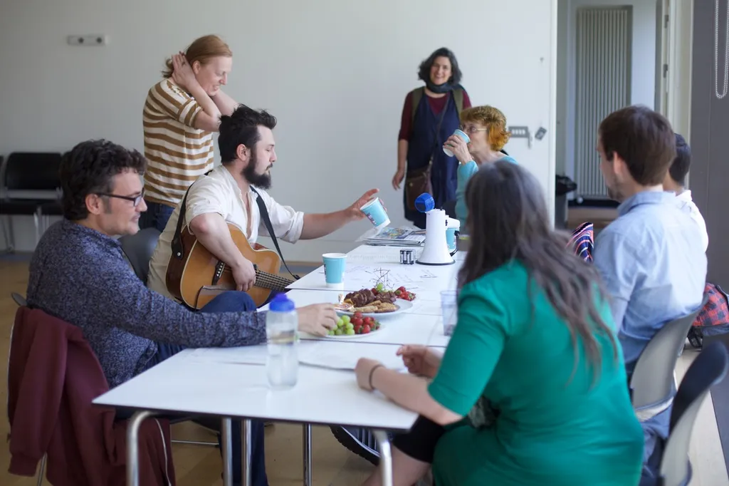 people sitting around a table having a discussion