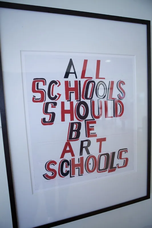 Close up image of student art reading "All schools should be art schools"