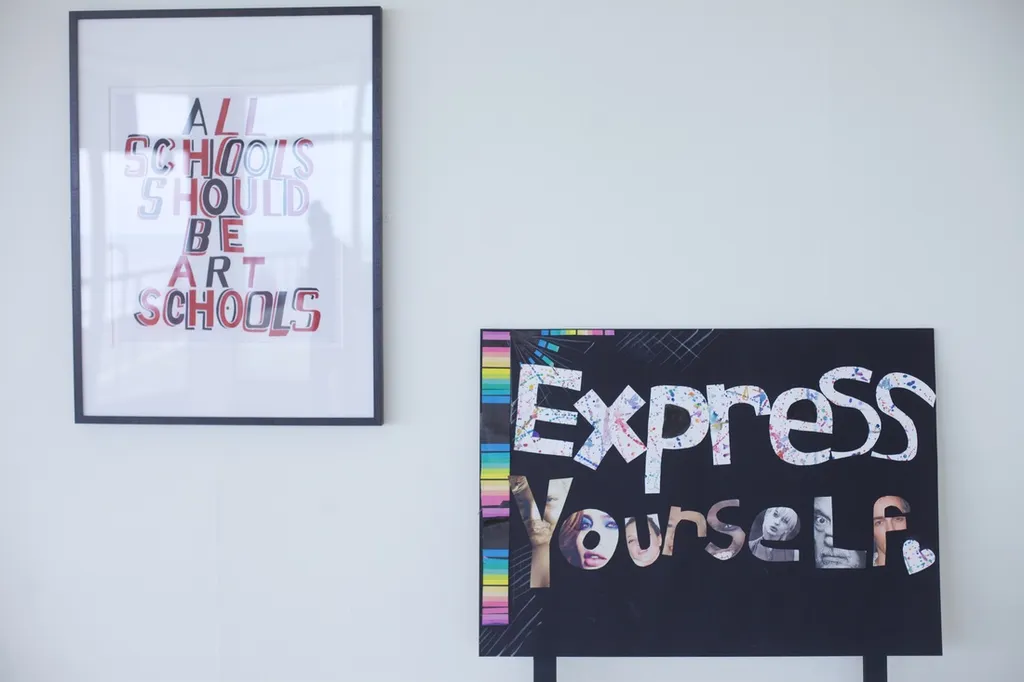 student artwork that reads "All schools should be art schools" and "express yourself"